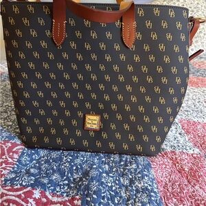 Dooney & Bourke women’s brown and tan handbag. Monogram with Dooney and Bourke